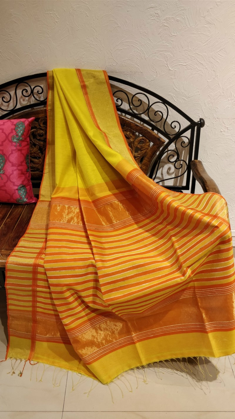 Yellow maheshwari saree with tissue border