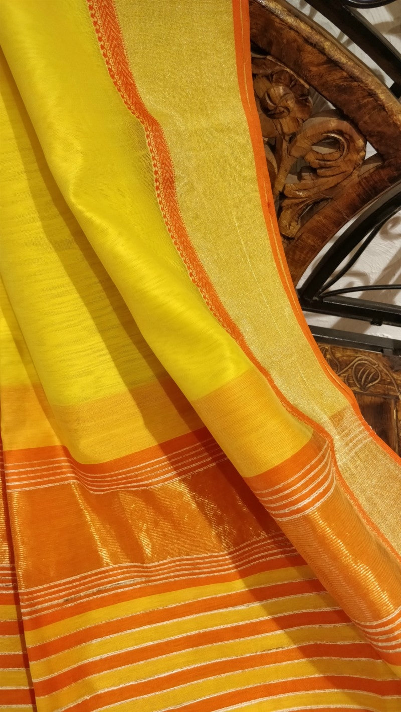 Yellow maheshwari saree with tissue border